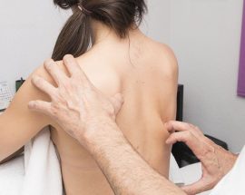 woman getting a spine adjustment